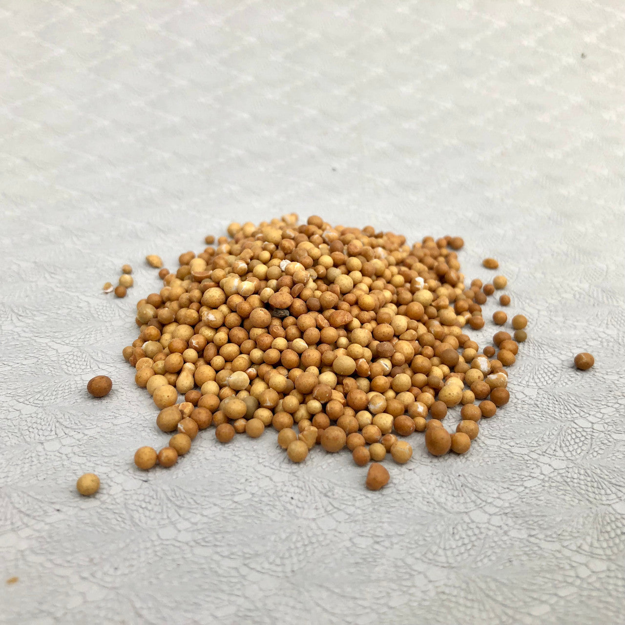 A loose pile of 14-14-14 time release fertilizer