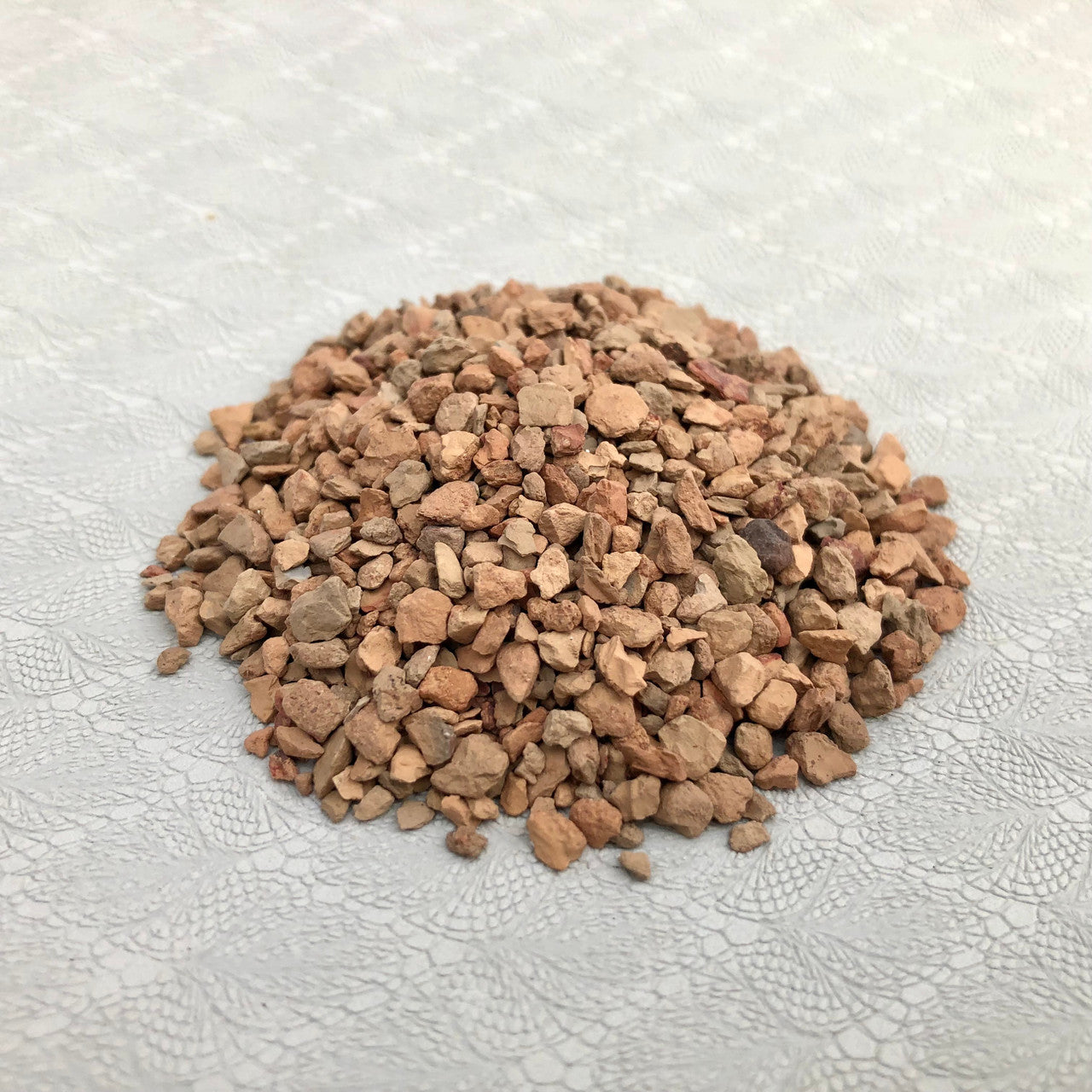 Loose pile of top dressing.
